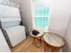 Functional laundry area with stacked washer and dryer, and a window for natural light at 1021 Barfield St, Charleston, SC 29492