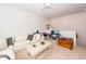 Bright living room with a comfortable white sofa, ceiling fan, and neutral carpet at 1021 Barfield St, Charleston, SC 29492