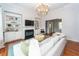 Spacious living room features a fireplace, built-in shelves and cabinets, and hardwood floors with an area rug at 1021 Barfield St, Charleston, SC 29492