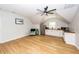 Cozy living space with kitchenette, wood-look flooring, and a ceiling fan for added comfort at 1021 Barfield St, Charleston, SC 29492