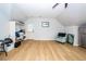 Open living area features wood-look floors, a comfortable chair, and convenient access to storage at 1021 Barfield St, Charleston, SC 29492