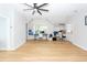 Bright living area with wood-look floors, ceiling fan, desk, and shelving for flexible use at 1021 Barfield St, Charleston, SC 29492