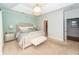 Bright main bedroom boasts tray ceilings, patterned wallpaper and light colored neutral carpet at 1021 Barfield St, Charleston, SC 29492