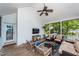 Relaxing screened patio with comfortable seating, ceiling fan, and outdoor TV at 1021 Barfield St, Charleston, SC 29492