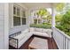 Cozy porch featuring a comfortable sectional sofa and a charming wooden coffee table at 1021 Barfield St, Charleston, SC 29492