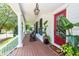 Relaxing porch with rocking chairs and hanging swing bed offers a cozy outdoor retreat at 1021 Barfield St, Charleston, SC 29492