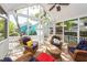 Inviting screened porch with wicker furniture and views of the surrounding neighborhood at 1021 Barfield St, Charleston, SC 29492