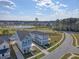 Aerial view of community with a pond and walking trail at 106 Wood Sage Run, Summerville, SC 29485