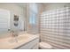 Clean bathroom with a single sink vanity and a shower with a striped curtain at 106 Wood Sage Run, Summerville, SC 29485