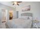 Bedroom featuring a patterned bedspread, en suite bathroom, and walk-in closet at 106 Wood Sage Run, Summerville, SC 29485