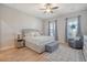 Comfortable bedroom featuring a neutral color palette, wood floors, and seating area at 106 Wood Sage Run, Summerville, SC 29485