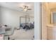 Well lit bedroom featuring a four-poster bed, ceiling fan, and connected bathroom at 106 Wood Sage Run, Summerville, SC 29485