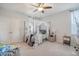 Cozy bedroom with a canopy bed, curtains, and a ceiling fan at 106 Wood Sage Run, Summerville, SC 29485