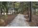 Gravel community path lined with trees for walking and recreation at 106 Wood Sage Run, Summerville, SC 29485
