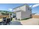 View of backyard with outdoor dining, hot tub, and detached garage at 106 Wood Sage Run, Summerville, SC 29485
