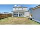 View of the back of the home with a hot tub on the covered porch at 106 Wood Sage Run, Summerville, SC 29485