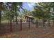Fenced in kayak storage with several kayaks on racks available to residents at 106 Wood Sage Run, Summerville, SC 29485