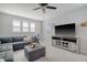 Comfortable living room with neutral colors and a modern entertainment center at 106 Wood Sage Run, Summerville, SC 29485