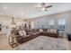 Spacious living room seamlessly connecting to the kitchen, featuring a comfortable sectional and stylish decor at 106 Wood Sage Run, Summerville, SC 29485