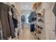 Walk-in closet featuring wire shelving, hanging rods, and wood floors for organized storage at 106 Wood Sage Run, Summerville, SC 29485