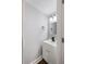 Well-lit half bathroom with white vanity, modern faucet, and neutral wall paint at 117 Wernham Ln, Moncks Corner, SC 29461