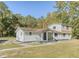 Charming two-story home with a covered front porch surrounded by lush greenery at 117 Wernham Ln, Moncks Corner, SC 29461