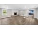 Spacious living room with fireplace, hardwood floors, and ample natural light at 117 Wernham Ln, Moncks Corner, SC 29461