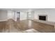 Open-concept living room featuring fireplace, hardwood floors, and neutral paint colors at 117 Wernham Ln, Moncks Corner, SC 29461
