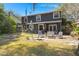 Spacious backyard featuring a furnished patio and green lawn at 125 Mansfield Blvd, North Charleston, SC 29418