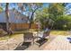 Landscaped backyard with patio seating, creating an ideal setting for outdoor enjoyment at 125 Mansfield Blvd, North Charleston, SC 29418