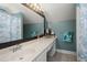 Full bathroom featuring a large mirror, spacious vanity, and under-sink cabinet storage at 125 Mansfield Blvd, North Charleston, SC 29418