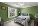 Green bedroom with soft light and a large window showing mature trees at 125 Mansfield Blvd, North Charleston, SC 29418