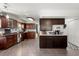 Open kitchen design boasts wood cabinets, tile flooring, and stainless steel appliances at 125 Mansfield Blvd, North Charleston, SC 29418
