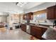 The kitchen features granite counters, tile floors and modern stainless steel appliances at 125 Mansfield Blvd, North Charleston, SC 29418