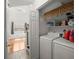 Bright laundry room features a folding table, ample storage shelves, and natural light at 125 Mansfield Blvd, North Charleston, SC 29418