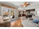 Open-concept living room flows into the kitchen, featuring wood floors and outdoor access at 125 Mansfield Blvd, North Charleston, SC 29418