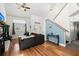 Inviting living room featuring hardwood floors, bright lighting, and stairs at 125 Mansfield Blvd, North Charleston, SC 29418