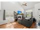 Bright living room boasts hardwood floors, cathedral ceilings, and natural light, creating a welcoming and airy atmosphere at 125 Mansfield Blvd, North Charleston, SC 29418