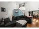 Spacious living area with vaulted ceilings, hardwood floors, and a cozy seating arrangement, bathed in natural light at 125 Mansfield Blvd, North Charleston, SC 29418