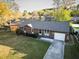 Aerial view of a brick house, showcasing the well-maintained lawn and landscaping at 132 Heather Dr, Summerville, SC 29486