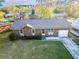Well-manicured lawn with charming brick home featuring attached garage in established neighborhood at 132 Heather Dr, Summerville, SC 29486