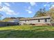 View of the backyard with a well-maintained lawn and mature trees at 132 Heather Dr, Summerville, SC 29486