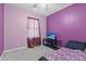 Cozy bedroom with a large window, carpeted floors, ceiling fan, and cute decor at 132 Heather Dr, Summerville, SC 29486