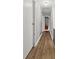 A wood-look hallway leads to rooms and living spaces within the home at 132 Heather Dr, Summerville, SC 29486