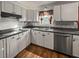 Bright kitchen featuring stainless steel appliances, tile backsplash, and durable countertops at 132 Heather Dr, Summerville, SC 29486
