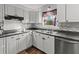 Bright kitchen featuring stainless steel appliances, tile backsplash, and durable countertops at 132 Heather Dr, Summerville, SC 29486