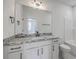 Bathroom featuring double vanity with granite countertops, modern fixtures, and a walk-in shower at 136 Mitch Ln, Holly Hill, SC 29059