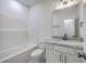 Bathroom featuring white vanity with granite countertop and a shower-tub combo at 136 Mitch Ln, Holly Hill, SC 29059
