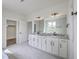 Bathroom featuring a double vanity with granite countertops, tile flooring, and neutral walls at 136 Mitch Ln, Holly Hill, SC 29059