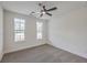 Bedroom with carpet, neutral walls, and dual windows letting in natural light at 136 Mitch Ln, Holly Hill, SC 29059